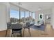 Bright and airy living room with city views and dining area at 860 Peachtree Ne St # 1617, Atlanta, GA 30308