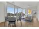 Bright living room with city views, hardwood floors, and modern furniture at 860 Peachtree Ne St # 1617, Atlanta, GA 30308
