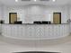 Modern curved reception desk with unique wall design at 860 Peachtree Ne St # 1617, Atlanta, GA 30308