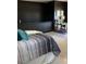 Relaxing bedroom with comfortable bedding, stylish rug, sleek wall decor, and a modern workspace at 972 Dekalb Ne Ave # 203, Atlanta, GA 30307