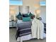 Well-lit bedroom with plush bedding, decorative pillows, and stylish bedside lamps on side tables at 972 Dekalb Ne Ave # 203, Atlanta, GA 30307