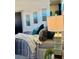 Comfortable bedroom featuring plush pillows, soft bedding, decorative art, and a bedside lamp at 972 Dekalb Ne Ave # 203, Atlanta, GA 30307