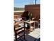 Inviting outdoor patio featuring wood furniture, stylish cushions, and a charming blue and white rug at 972 Dekalb Ne Ave # 203, Atlanta, GA 30307