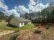 A serene backyard featuring lush greenery and a charming patio, perfect for relaxation and outdoor enjoyment at 1217 Eagles Nest Cir, Carrollton, GA 30116