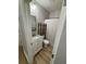 Clean bathroom with white vanity, a marble countertop, and light flooring at 1217 Eagles Nest Cir, Carrollton, GA 30116