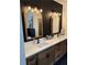 Bathroom with double vanity and black hexagon tile at 1217 Eagles Nest Cir, Carrollton, GA 30116