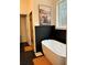 Bathroom with freestanding tub and black shiplap at 1217 Eagles Nest Cir, Carrollton, GA 30116