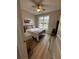 Bedroom with light walls, a full bed, and light wood-look flooring at 1217 Eagles Nest Cir, Carrollton, GA 30116