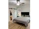 Main bedroom with large window and ceiling fan at 1217 Eagles Nest Cir, Carrollton, GA 30116
