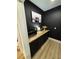 Coffee bar with black cabinets and wood countertop at 1217 Eagles Nest Cir, Carrollton, GA 30116