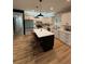 Modern kitchen with white shaker cabinets, quartz countertops, and stainless steel appliances at 1217 Eagles Nest Cir, Carrollton, GA 30116