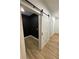 Small office with black walls and barn door at 1217 Eagles Nest Cir, Carrollton, GA 30116