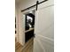 Walk-in pantry with barn door and wood countertop at 1217 Eagles Nest Cir, Carrollton, GA 30116