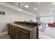 Wet bar with granite countertop and cabinets at 3352 Forest Vista Dr, Dacula, GA 30019