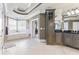 Spa-like bathroom with soaking tub, walk-in shower, and ample cabinet space at 3352 Forest Vista Dr, Dacula, GA 30019