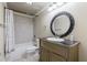 Basement bathroom with shower/tub combo, vanity, and large mirror at 3352 Forest Vista Dr, Dacula, GA 30019