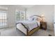 Comfortable bedroom with a queen-size bed, ample natural light and access to balcony at 3352 Forest Vista Dr, Dacula, GA 30019