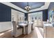 Formal dining room with navy walls, hardwood floors, and a chandelier at 3352 Forest Vista Dr, Dacula, GA 30019