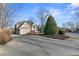 Spacious driveway leading to a stunning brick home with mature trees at 3352 Forest Vista Dr, Dacula, GA 30019