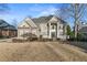 Brick two-story home with a large front yard and professionally landscaped grounds at 3352 Forest Vista Dr, Dacula, GA 30019