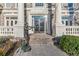 Elegant entryway with double doors, classic columns, and bronze statues at 3352 Forest Vista Dr, Dacula, GA 30019