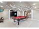 Basement game room with pool table at 3352 Forest Vista Dr, Dacula, GA 30019