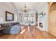 Spacious Gathering room boasts hardwood floors, fireplace, and built-in shelving at 3352 Forest Vista Dr, Dacula, GA 30019
