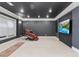 Finished basement home theater room with large screen TV and comfortable seating at 3352 Forest Vista Dr, Dacula, GA 30019