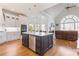 Spacious kitchen with large island, custom cabinetry, and hardwood floors at 3352 Forest Vista Dr, Dacula, GA 30019