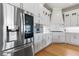 Modern kitchen with stainless steel appliances and white shaker cabinets at 3352 Forest Vista Dr, Dacula, GA 30019