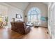 Spacious living room with a fireplace, large windows, and comfortable seating at 3352 Forest Vista Dr, Dacula, GA 30019