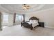 Spacious main bedroom with a large bed, carpeted floor, and ensuite bathroom access at 3352 Forest Vista Dr, Dacula, GA 30019