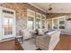 Spacious covered patio with wicker furniture, perfect for outdoor relaxation at 3352 Forest Vista Dr, Dacula, GA 30019