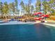 Pool area with water slides and surrounding deck at 3352 Forest Vista Dr, Dacula, GA 30019