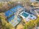 Aerial view of tennis courts, pool, and playground at 3352 Forest Vista Dr, Dacula, GA 30019