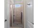 Clean shower with glass enclosure and neutral-toned tile at 3352 Forest Vista Dr, Dacula, GA 30019