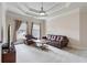Bright sitting room with coffered ceiling, leather sofa, armchair, and coffee table at 3352 Forest Vista Dr, Dacula, GA 30019