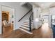 Elegant staircase with dark wood railing, connecting the main and upper levels at 3352 Forest Vista Dr, Dacula, GA 30019