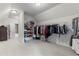Spacious walk-in closet with ample shelving and hanging space at 3352 Forest Vista Dr, Dacula, GA 30019