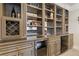 Well-stocked wet bar with ample storage at 3352 Forest Vista Dr, Dacula, GA 30019
