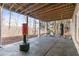 Covered outdoor basement workout area with punching bag and exercise bike at 3352 Forest Vista Dr, Dacula, GA 30019