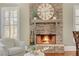 Stone fireplace creates a cozy focal point in the living area at 229 Hunley Ct, Alpharetta, GA 30005