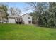 Spacious green backyard featuring a deck, patio, and lush landscaping at 2808 Mountbery Dr, Snellville, GA 30039