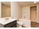 Bathroom features vanity sink, toilet, bathtub, and shower combination at 2808 Mountbery Dr, Snellville, GA 30039