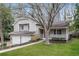 Traditional home with a covered porch, attached garage, and lush front lawn at 2808 Mountbery Dr, Snellville, GA 30039