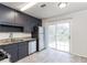 Well-equipped kitchen with granite countertops and stainless steel appliances near backyard at 2808 Mountbery Dr, Snellville, GA 30039