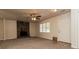 Open living room with fireplace, fresh carpet, and adjacent dining area at 2808 Mountbery Dr, Snellville, GA 30039