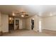 Spacious living room connects to kitchen and dining spaces with stairs in view at 2808 Mountbery Dr, Snellville, GA 30039