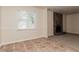 Cozy living room featuring a stone fireplace, neutral carpet, and natural light at 2808 Mountbery Dr, Snellville, GA 30039