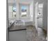 Main bathroom with granite countertop and soaking tub at 5165 Hanover St, Atlanta, GA 30349